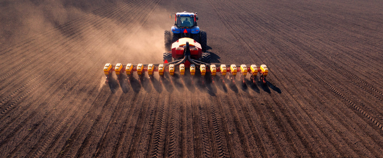 A Tractor With A Seeder On The Field Drone View, Traditional Cultivation
